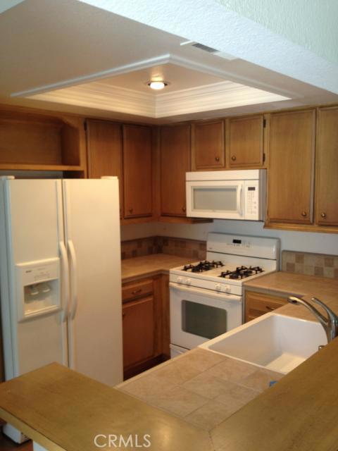 Kitchen with Refrigerator (Included), Farmers Sink & Coffered Ceiling - 24247 Avenida De Las Flores, Laguna Niguel CA 92677 - photo 1