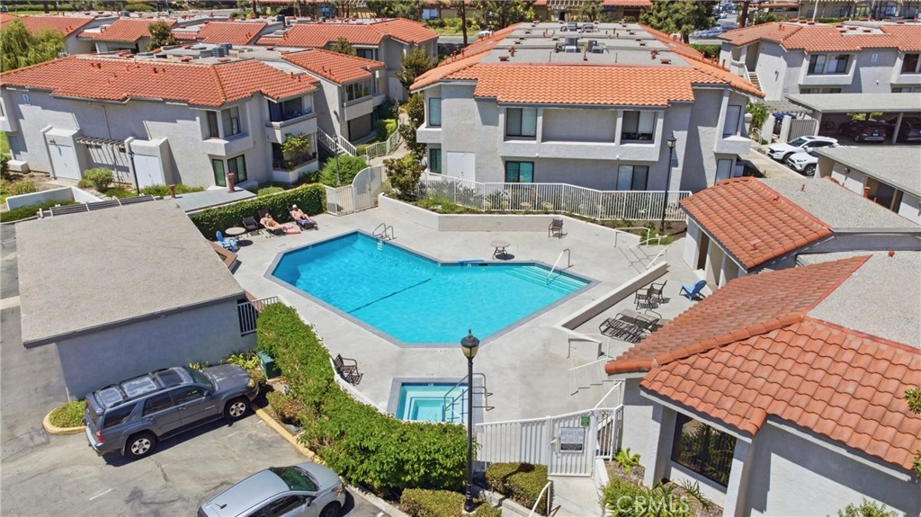 Casa La Paz residents enjoy access to a community pool and spa surrounded by beautifully maintained grounds. - 24278 El Pilar, Laguna Niguel CA 92677 - photo 19