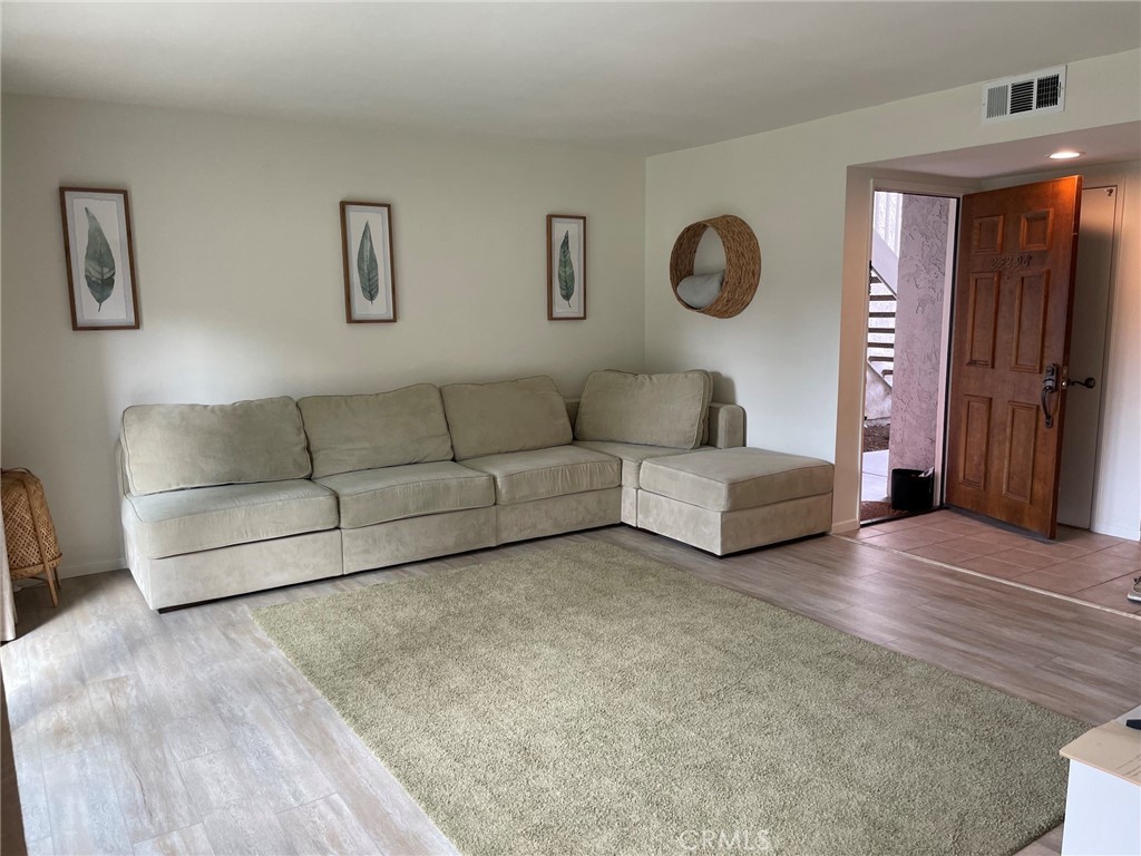 Living room with Vinyl plank flooring - 24298 El Pilar, Laguna Niguel CA 92677 - photo 8