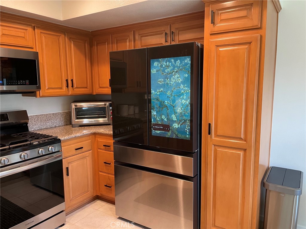 Kitchen with Refrigerator - 24298 El Pilar, Laguna Niguel CA 92677 - photo 10
