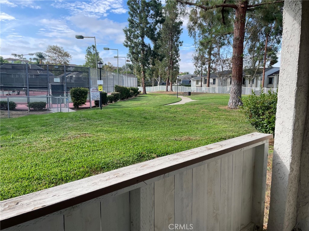 Patio with view of green belt and tennis courts - 24298 El Pilar, Laguna Niguel CA 92677 - photo 13