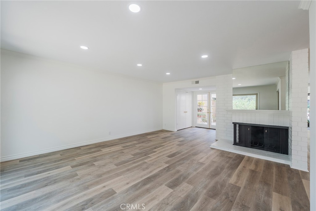 Living room with view of front double doors & double door coat closet - 24356 Hillview, Laguna Niguel CA 92677 - photo 7