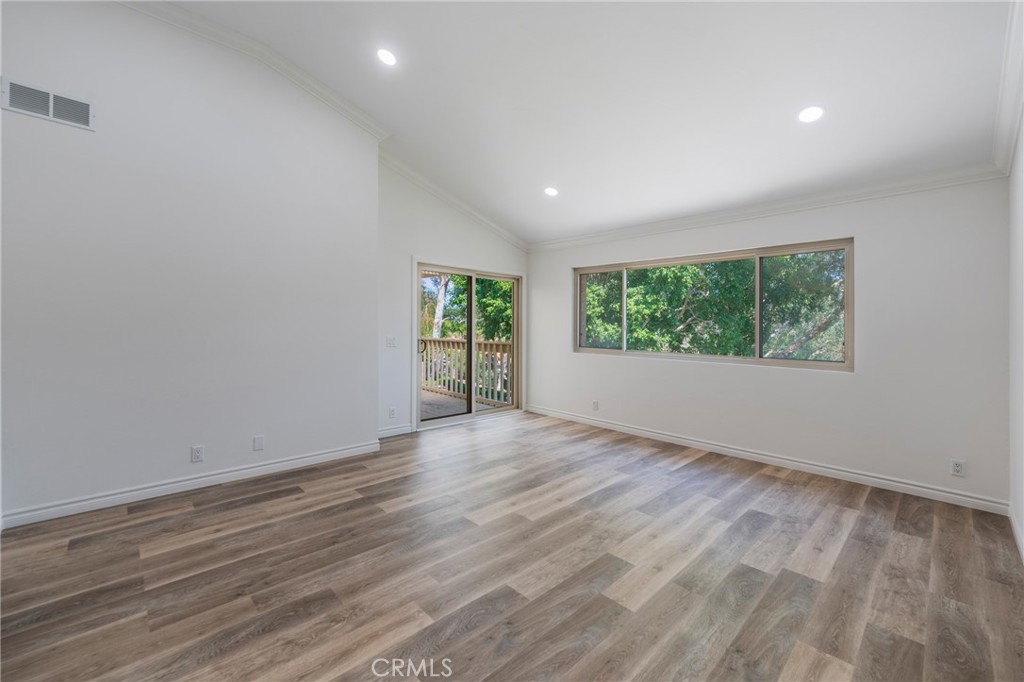 Primary bedroom with sliding door to private balcony - 24356 Hillview, Laguna Niguel CA 92677 - photo 19