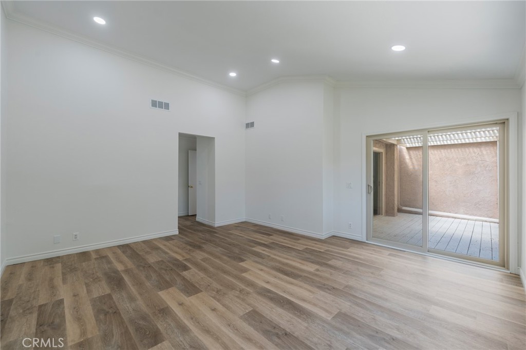 Primary bedroom with sliding door to private balcony - 24356 Hillview, Laguna Niguel CA 92677 - photo 20