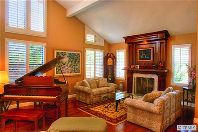 Open living room with custom fireplace mantel.... - 24752 QUEENS Court, Laguna Niguel CA 92677 - photo 1
