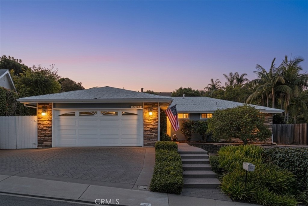 Beautifully lit curb appeal with stone-accent façade and welcoming entryway. - 25112 Armagosa, Laguna Niguel CA 92677 - photo 1