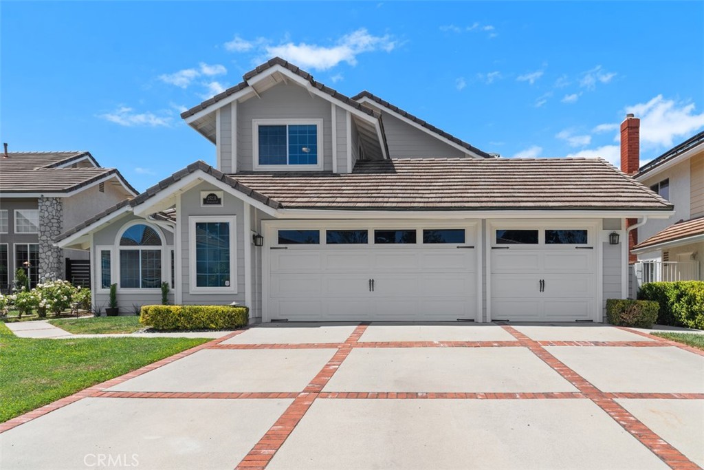 New siding and paint, fresh and bright. 3-car garage with the car driveway and fourth space behind the single garage doo - 25231 Spindlewood, Laguna Niguel CA 92677 - photo 1