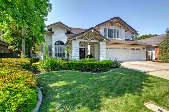 Front elevation with 3 car garage and brick ribbon in driveway. Stunning curb appeal. - 25372 Shadywood, Laguna Niguel CA 92677 - photo 1