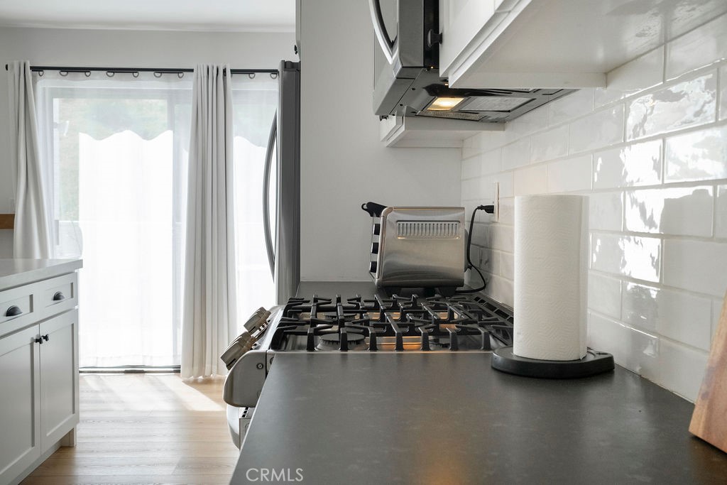 Kitchen view with sheers closed. - 25655 Paseo La Cresta 47, Laguna Niguel CA 92677 - photo 18