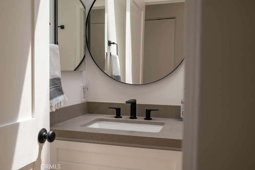 Upstair full bathroom: Sink, toilet, tub with showerhead. - 25655 Paseo La Cresta 47, Laguna Niguel CA 92677 - photo 32