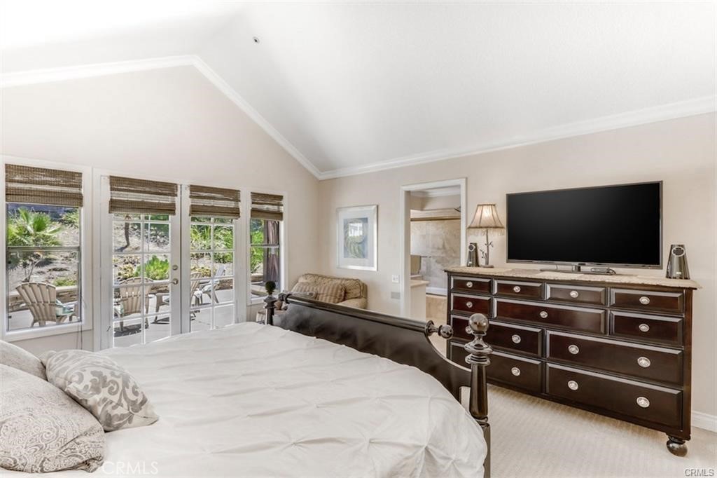 Expansive primary bedroom with pool view - 25662 Cresta Loma, Laguna Niguel CA 92677 - photo 32