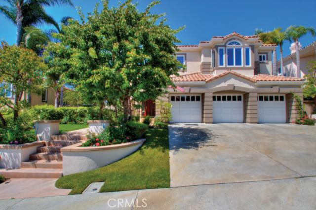 Excellent curb appeal with gardens and green grassed lawn walkway into private gated courtyard entrance area. Exquisite - 27 Emerald Glen, Laguna Niguel CA 92677 - photo 1