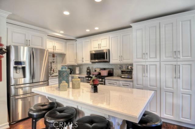Glamorous modern kitchen featuring designer touches... quartz counters, custom cabinetry, custom buffet bar and so much - 27190 Ryan Drive, Laguna Niguel CA 92677 - photo 1