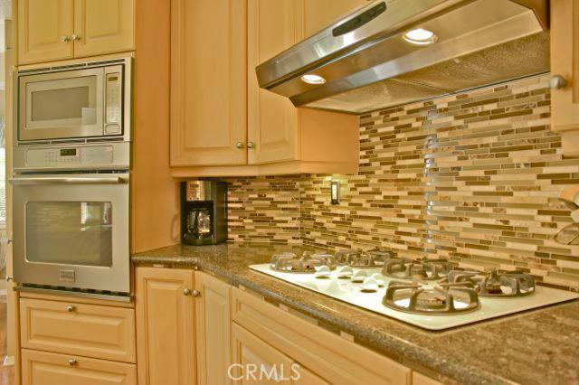 Built-in, brand new stainless steel appliances compliment the kitchen. Warm, neutral colors and ample storage space. - 27711 Motherlode Court, Laguna Niguel CA 92677 - photo 1