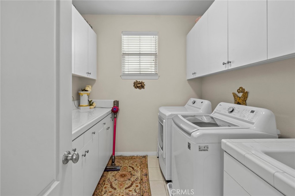 Upstairs Laundry Room - 27781 Country Lane Rd, Laguna Niguel CA 92677 - photo 25