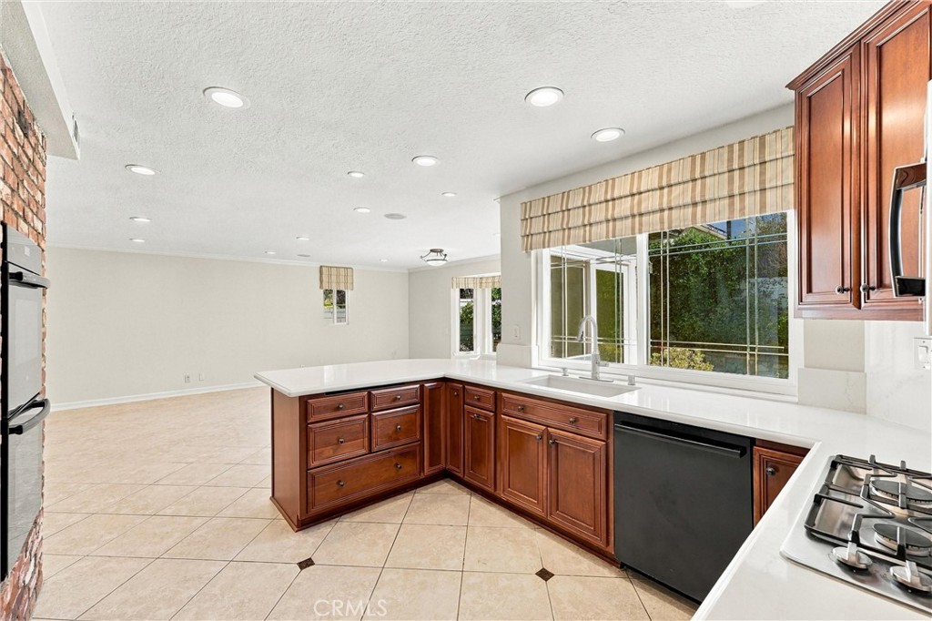 The great room! Kitchen is open to large casual dining area and family room. - 28172 Bluebell Drive, Laguna Niguel CA 92677 - photo 8