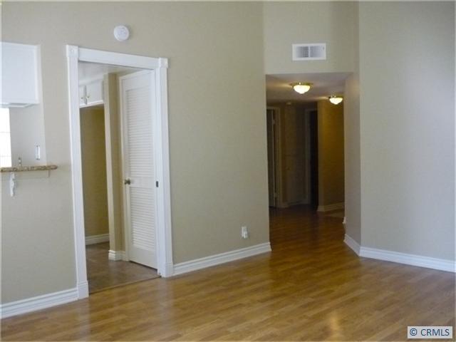 Living Room with 9 foot ceilings and is open to kitchen. - 28201 MONTECITO 60, Laguna Niguel CA 92677 - photo 1