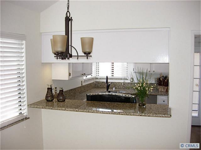 Your newly remodeled kitchen with breakfast bar - 28212 SORRENTO 90, Laguna Niguel CA 92677 - photo 1
