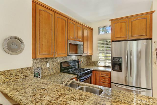 Fully upgraded kitchen with granite, stainless steel appliances and new cabinets. - 28383 Paseo El Siena, Laguna Niguel CA 92677 - photo 1