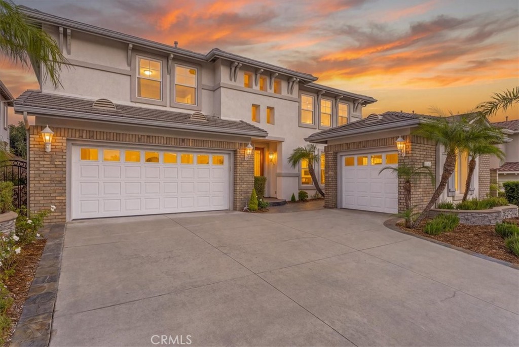 Prestigious estate with a grand three-car garage glowing at sunset. - 28932 Drakes Bay, Laguna Niguel CA 92677 - photo 4