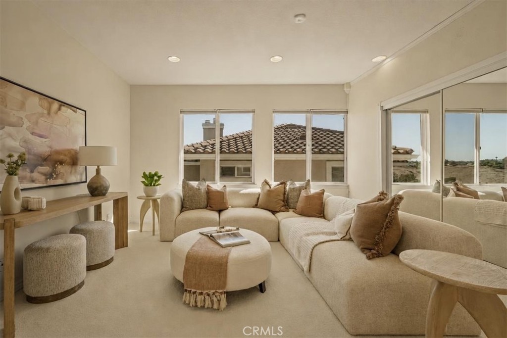 A bright, inviting loft with sweeping views through walls of windows. - 28932 Drakes Bay, Laguna Niguel CA 92677 - photo 14