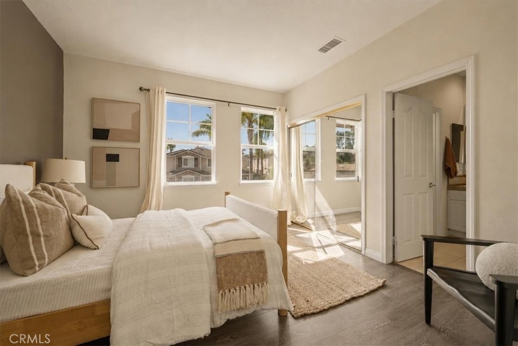 A light-filled third bedroom with warm wood flooring - 28932 Drakes Bay, Laguna Niguel CA 92677 - photo 19