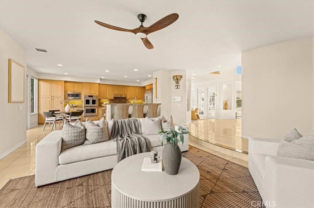 A sophisticated living space flowing seamlessly into a gourmet kitchen with an elegant breakfast bar - 28932 Drakes Bay, Laguna Niguel CA 92677 - photo 30