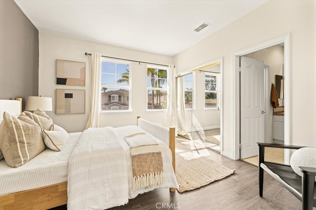 A light-filled third bedroom with warm wood flooring - 28932 Drakes Bay, Laguna Niguel CA 92677 - photo 58