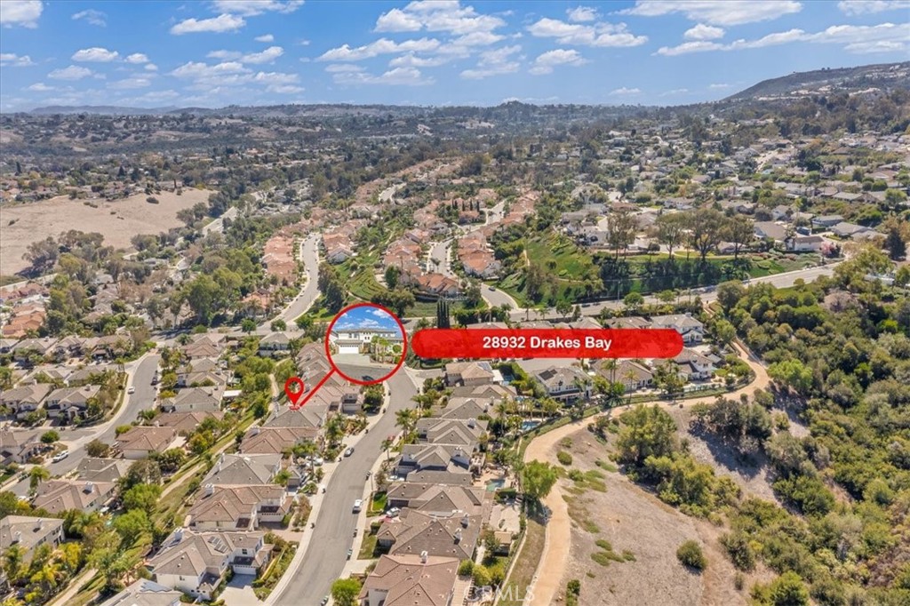 An elevated aerial view of this prestigious Hillcrest enclave, where manicured homes, winding streets, and rolling hills - 28932 Drakes Bay, Laguna Niguel CA 92677 - photo 72
