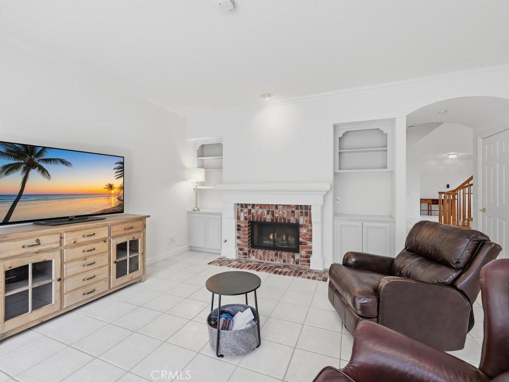 Family room has double sided fireplace with built in shelving - 29352 Clipper Way, Laguna Niguel CA 92677 - photo 15