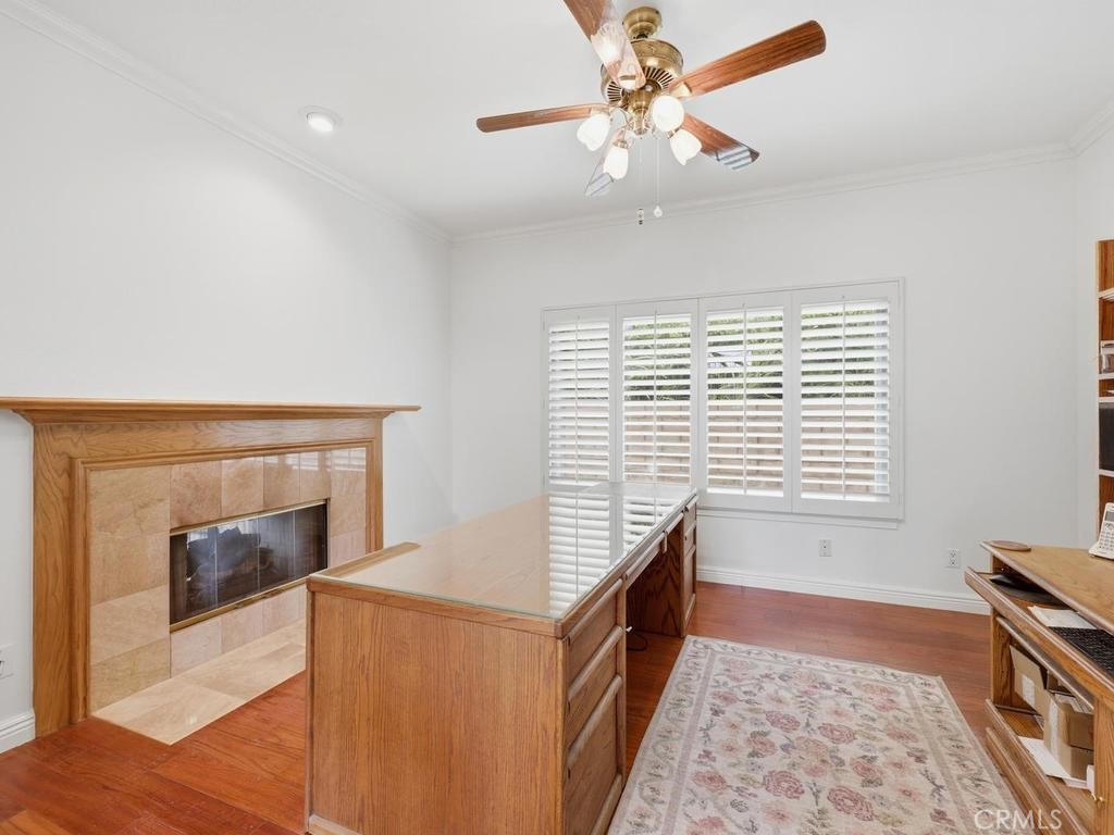 Downstairs bedroom/office with double sided fireplace - 29352 Clipper Way, Laguna Niguel CA 92677 - photo 16