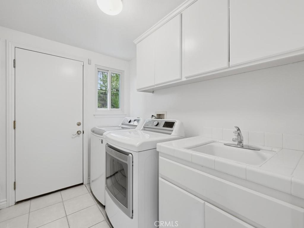 Downstairs laundry room - 29352 Clipper Way, Laguna Niguel CA 92677 - photo 19