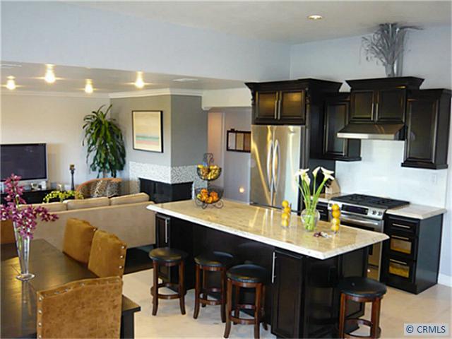 Great room. Entertainer & any inspiring chef delight. Notice the beautiful custom tiles on fireplace. Warm romantic fire - 29482 SEDGEWICK Circle, Laguna Niguel CA 92677 - photo 1