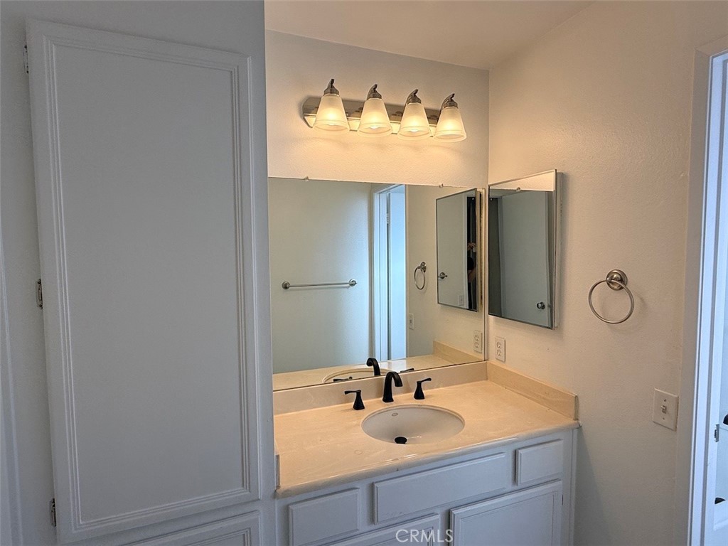 Vanity with new faucet, large storage cabinet - 29792 Sea Shore Lane, Laguna Niguel CA 92677 - photo 8