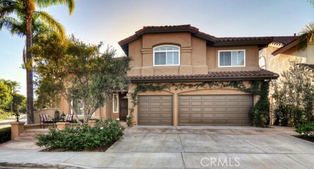 Front of home with three car garage and three parking spaces in driveway. Room for 6 cars. - 3 Westgate, Laguna Niguel CA 92677 - photo 1