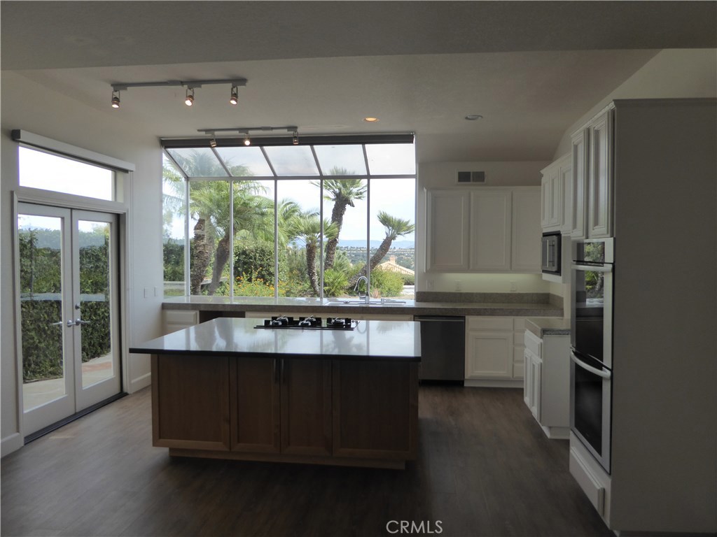 Beautiful updated gourmet kitchen. Large island with so much storage and breakfast bar - 30552 Mirandela Lane, Laguna Niguel CA 92677 - photo 1