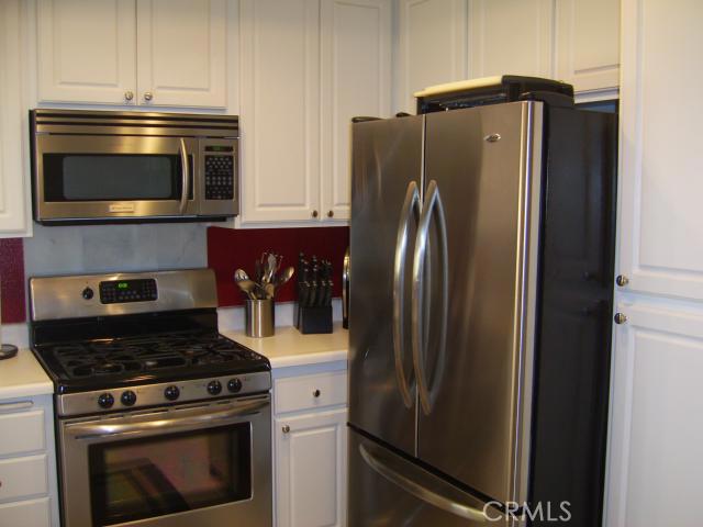 Upgraded Kitchen with Stainless Steel Appliances - 30902 Clubhouse Drive 21H, Laguna Niguel CA 92677 - photo 1