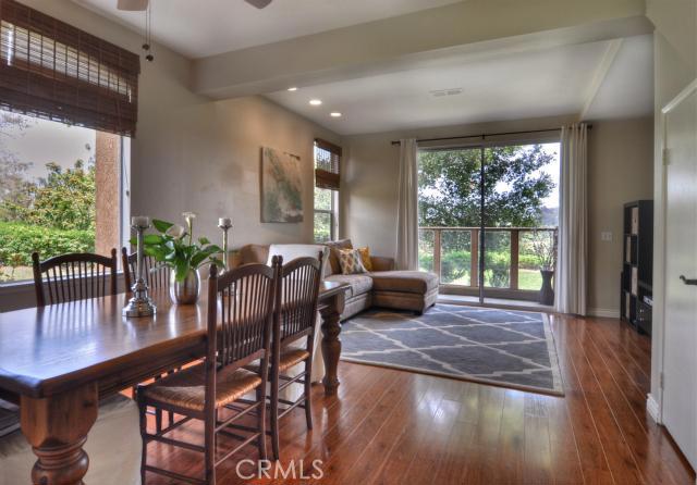 Enter into the beautiful Dining Room / Living Room featuring custom hardwood flooring and amazing views! - 30902 Clubhouse Drive 22f, Laguna Niguel CA 92677 - photo 1