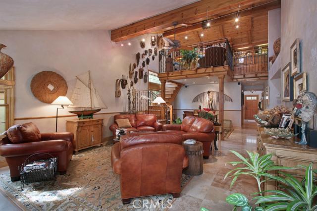 Spacious living room with high, beamed ceiling - 31356 Isle Vista, Laguna Niguel CA 92677 - photo 1