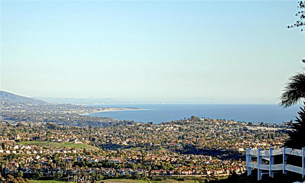 From the rear patio, the panoramic, ocean w/white-water view is simply sensational. It sweeps along the hills and golf c - 31416 Flying Cloud Drive, Laguna Niguel CA 92677 - photo 1