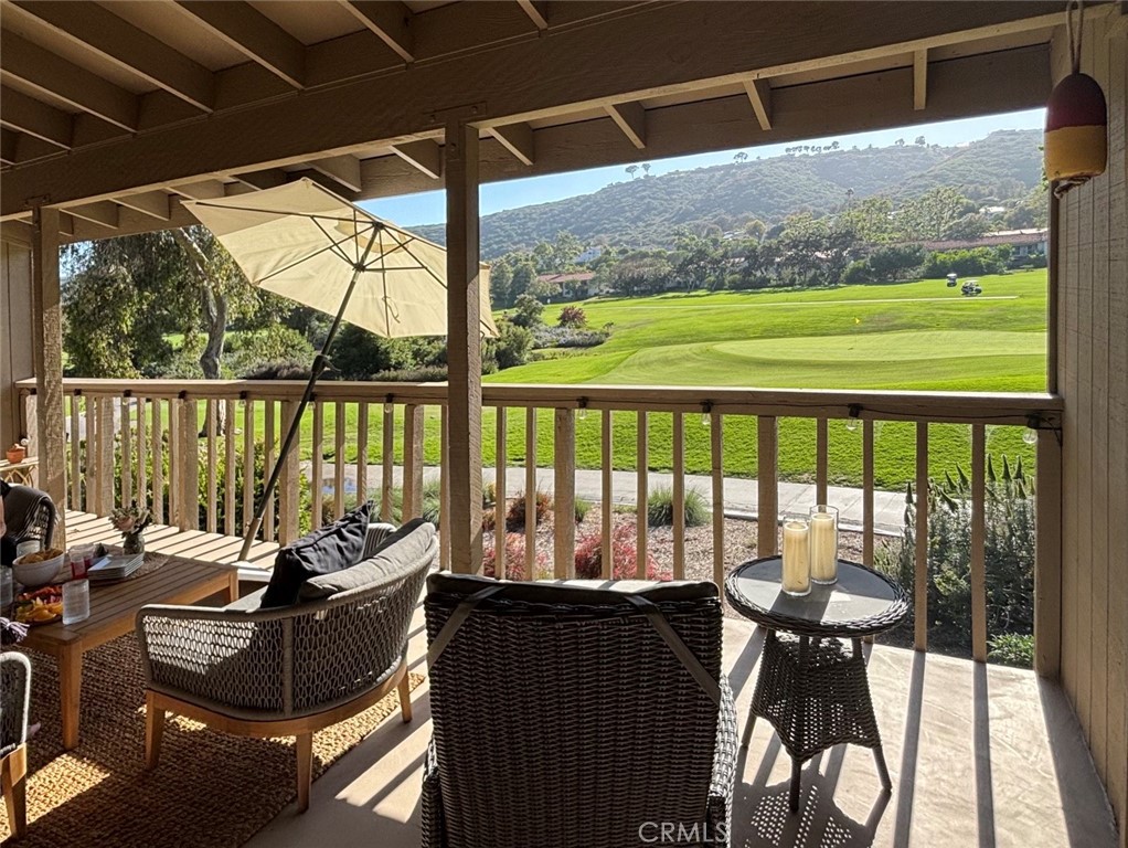 Golf course views are visible from the covered deck, living/dining area, primary suite and second bedroom." - 31603 E Nine 60-G, Laguna Niguel CA 92677 - photo 1