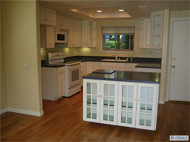 Kitchen with Island Counter and Display Cabinet - 31648 W NINE Drive, Laguna Niguel CA 92677 - photo 1
