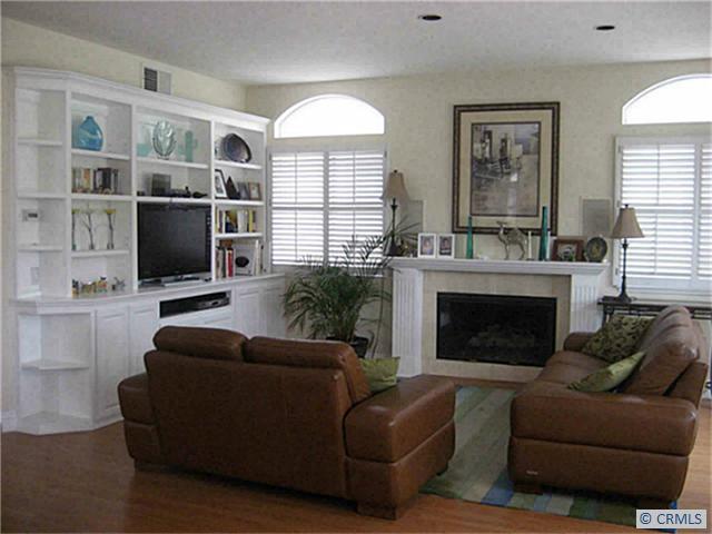 Family Room complete with fire place and custom built in entertainment center, - 34 CORSICA, Laguna Niguel CA 92677 - photo 1