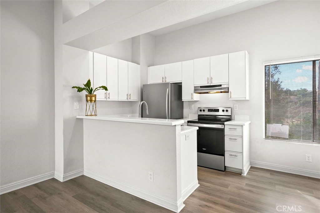 Kitchen with stainless steel appliances - 39 Martinique Street 273, Laguna Niguel CA 92677 - photo 6