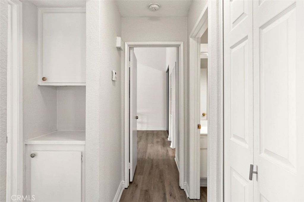 Hallway leading to the bedrooms - 39 Martinique Street 273, Laguna Niguel CA 92677 - photo 13