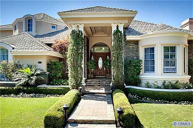 Cal-French design showing Smooth trowel finish stucco exterior with ledge-rock accent...aggregate and canyon stone walkw - 4 ALTA HILLS Way, Laguna Niguel CA 92677 - photo 1