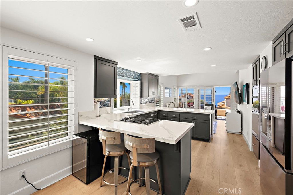 Newly designed and remodeled to maximize ocean views - an open kitchen made for memories. - 67 Marseille, Laguna Niguel CA 92677 - photo 1