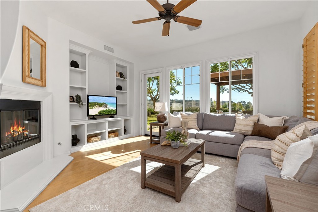 Virtually staged fireplace. Family room with fireplace and views! Builtins too! - 8 Chantonnay, Laguna Niguel CA 92677 - photo 13