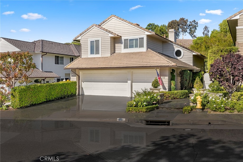 Incredible curb appeal, Cape Cod style home, stone walkway and mature landscaping. - 99 OAKCLIFF Drive, Laguna Niguel CA 92677 - photo 1