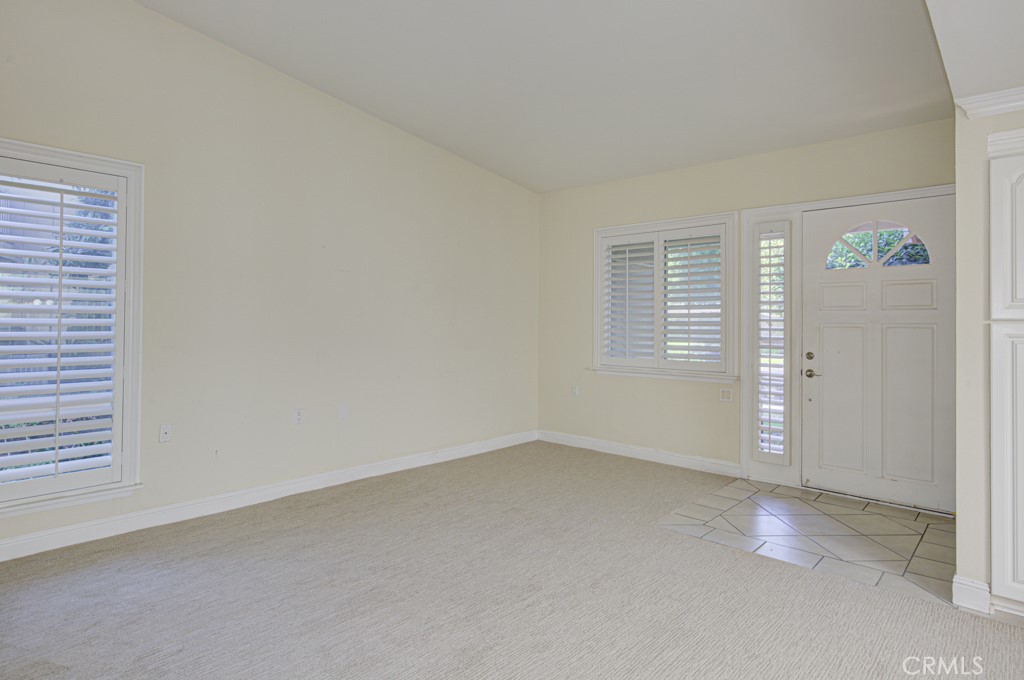 Another view of the living room. Note the brand new carpeting and high ceiling. - 2 Via Castilla E, Laguna Woods CA 92637 - photo 5